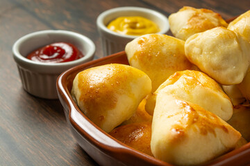 mixed roasted or baked party snack known as ' salgadinho de festa' on a ceramic bowl