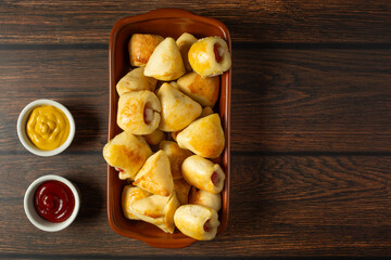 mixed roasted or baked party snack known as ' salgadinho de festa' on a ceramic bowl