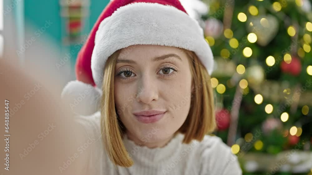 Sticker young blonde woman doing video call waving celebrating christmas at home