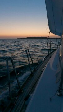 Sailboat Sailing to Sálvora Island: Slow Motion Seascape at Blue Hour. Serene voyage in stunning coastal scenery.