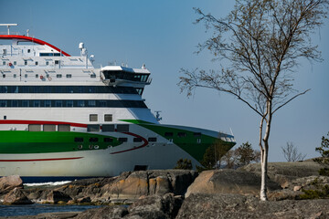 Passenger freighter roll on roll off ro-ro pax ferries in port of Helsinki, Finland with city...