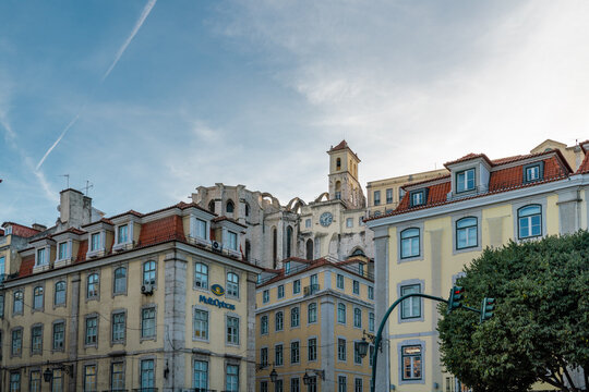 Plaza Dom Pedro IV in the city center of Lisbon. View of "Fonte Sul do Rossio" Fountain.  In background is Carmo Convent Archaeological museum. Travel destination