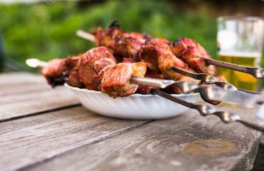 Top view of tasty shish kebab from pork on plate