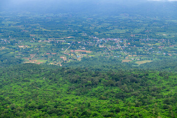 The foreground view from a viewpoint in Sai Thong National Park, Thailand, overlooks  green forest nature and city of Chaiyaphum