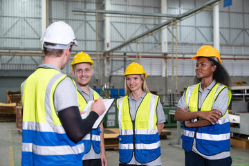 Supervisor engineering meeting with male and female engineers teams in factory industry. Teamwork professionals discuss together in carton sheet production manufacturing factory