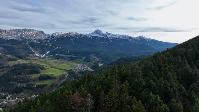 Skyward gaze captures Villard's alpine allure and bustling tourism. 
