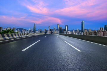 Fototapeta na wymiar Asphalt highway road and urban skyline in Shenzhen at sunset, Guangdong Province, China.