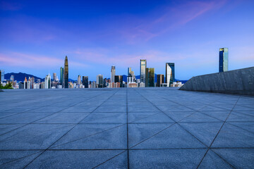 Empty square floors and city skyline in Shenzhen at dusk, Guangdong Province, China.