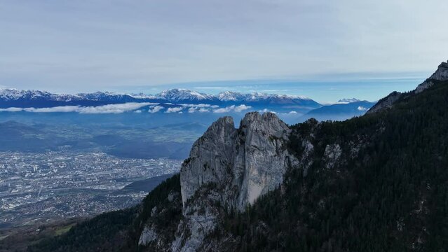 Aerial shot passing by limestone mountains over Grenoble 