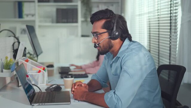 Call center, happy Indian man and celebration of success at computer, excited winning or motivation of telemarketing targe. Sales consultant celebrate achievement of deal.