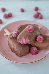 melted raspberry ice cream in chocolate