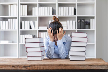 Portrait of frustrated worried young Asian girl looks at laptop upset by bad news, negative bullying message, troubled with problem online or email notification.