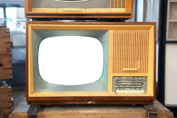 Old TV with a white screen on the bedside table. Retro technology concept.