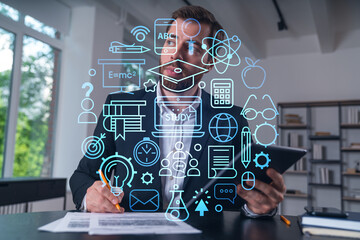 Considered businessman in formal wear signing contract holding tablet device at office room with papers. Concept of successful business deal, agreement, partnership, documents. Education icons.