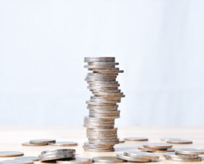 coins stacked high on each other in different positions. Banking, economics, saving money.