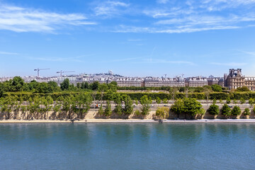 View of Montmartre Hill and Sacre Coeur Church, Seine River embankment, Paris, France