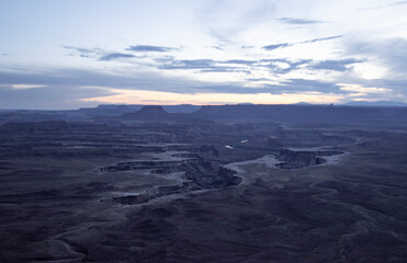 SunSet at Canyonlands national park in Utah; the warm golden light illuminates the rock formations. 
