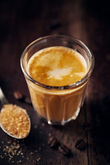 Glass of delicious Latte Coffee on rustic wooden background. Close-up - 648954237