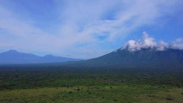 nature scenery of Baluran National Park, Indonesia, view from a height using a drone, Baluran National Park with Mount Baluran as a background,Forest area,  east java indonesia