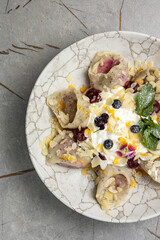 Ukrainian cuisine. Delicious dumplings with sour cream