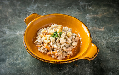 perch salad with bread and orange peel , isolated on marble background , horizontal 
