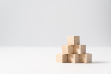 Obraz premium Pyramid of six wooden cubes, on white background