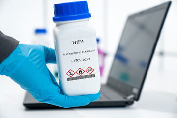 HfF4 hafnium(IV) fluoride CAS 13709-52-9 chemical substance in white plastic laboratory packaging