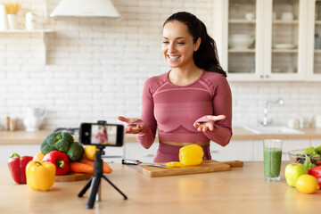Blogger Woman In Fitwear Talking To Smartphone Camera Cooking Indoor