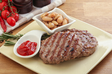 Grilled beef burger cutlet with sauce