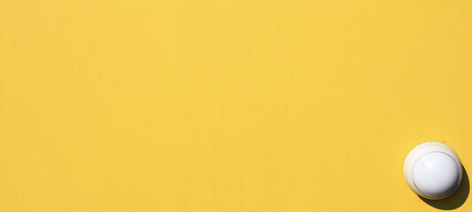 Yellow wall, texture, background. The wooden wall, painted with enamel paint. Flat surface in...