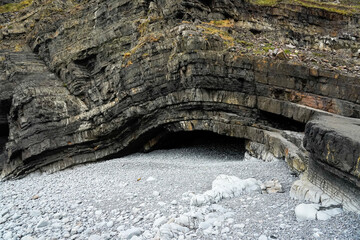 Cave in bend stone layers - Hartland Quay