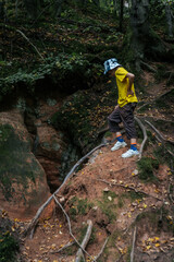 Happy face exploring cave architecture. Solo adventure connecting with natures beauty. Happy Man Exploring Architecture Alone in Nature. Deep Underground Exploring the Mysterious Abyss of the Hidden 