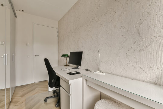 Interior of modern workplace with computer and desk