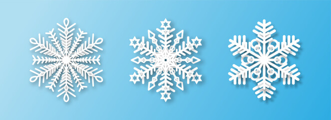 A set of three white snowflakes on a blue background. The element of Christmas and New Year. The symbol of winter. Vector illustration.