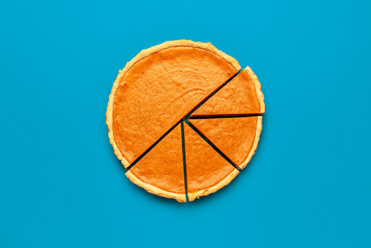 Homemade pumpkin tart minimalist on a blue background