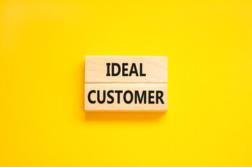 Ideal customer symbol. Concept words Ideal customer on beautiful wooden blocks. Beautiful yellow...