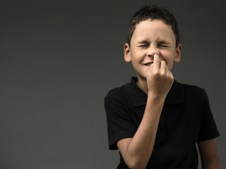 boy picking his nose with white background with people stock image stock photo
