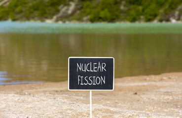 Nuclear fission symbol. Concept words Nuclear fission on beautiful black chalk blackboard....