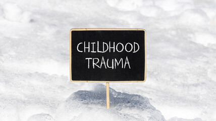 Childhood trauma symbol. Concept words Childhood trauma on beautiful black chalk blackboard....