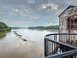 debris floating on the rising Missouri River seen from an old railroad bridge in Boonville, MO