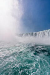 Wide angle view of Horseshoe Falls waterfall at sunny day, view from the boat