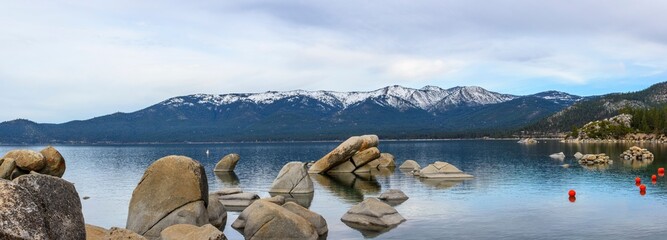 Tranquil Tahoe Beauty: 4K Image of Lake Tahoe View from Lakeshore with Stone and Sky