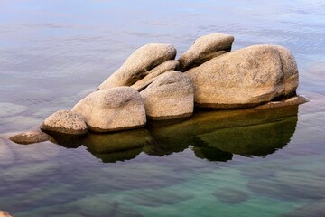 Tranquil Tahoe Beauty: 4K Image of Lake Tahoe View from Lakeshore with Stone and Sky