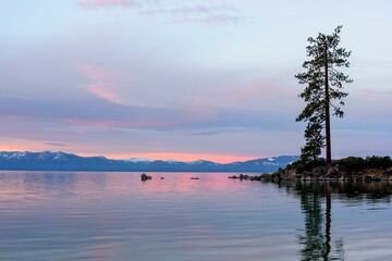 Tranquil Tahoe Beauty: 4K Image of Lake Tahoe View from Lakeshore with Stone and Sky
