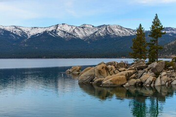 Tranquil Tahoe Beauty: 4K Image of Lake Tahoe View from Lakeshore with Stone and Sky