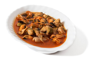 A white plate with pickled mussels, isolated on a white background. Pickled mussels are delicious sea mollusks in an exquisite sweet and sour sauce that awakens the senses.