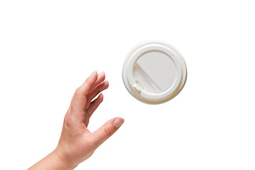 Hand takes a paper cup of coffee with a plastic white lid on a transparent background, top view