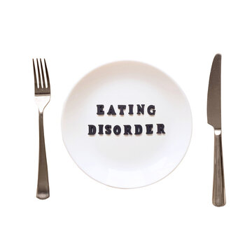 The text Eating Disorder on the plate. Plate, fork and knife on a transparent background