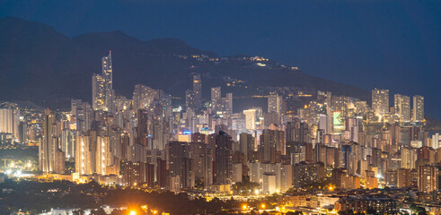 Obraz premium Benidorm skyline with skyscrapers at night.