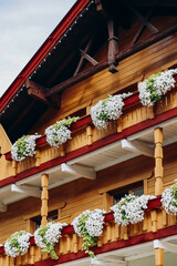 Fototapeta na wymiar Beautiful traditional Austrian facades decorated with flowers